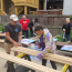 Constructing new church signs before the Pride Parade